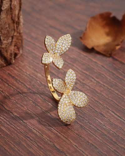 Offener Ring im IG-Stil mit glänzender Blumenverkupferung, Inlay aus Zirkon und 18 Karat vergoldet