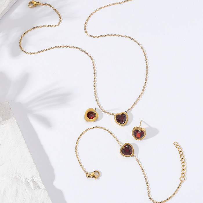 Neues schlichtes Herz-Halsketten-Ohrring-Armband-Set aus Edelstahl mit Granat-Zirkon-Intarsien und 18 Karat Gold