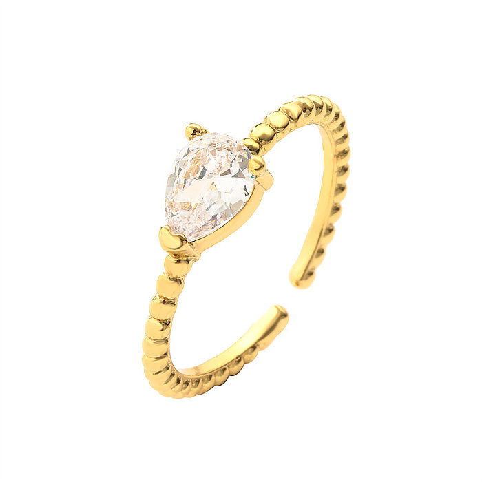 Lässiger, glänzender, wassertropfenförmiger, rechteckiger, offener Ring mit Inlay aus Zirkon und vergoldetem Zirkon