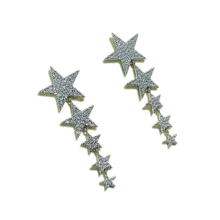 1 paire de clous d'oreilles en cuivre avec incrustation d'étoiles de trajet, pierres précieuses artificielles