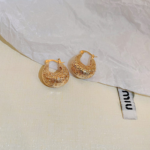 1 paire de boucles d'oreilles en cuivre en forme de U.