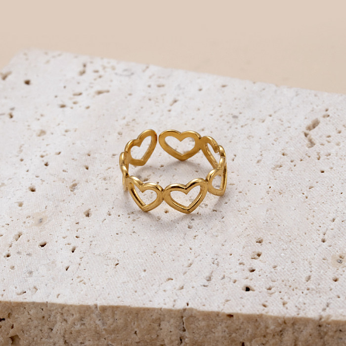 Estilo retro clássico rosto humano formato de coração aço inoxidável criss cross chapeamento banhado a ouro 18K anel aberto