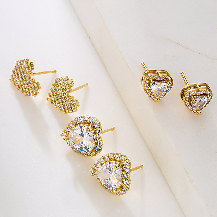 Brincos de orelha de cobre em formato de coração da moda com zircão banhado a ouro