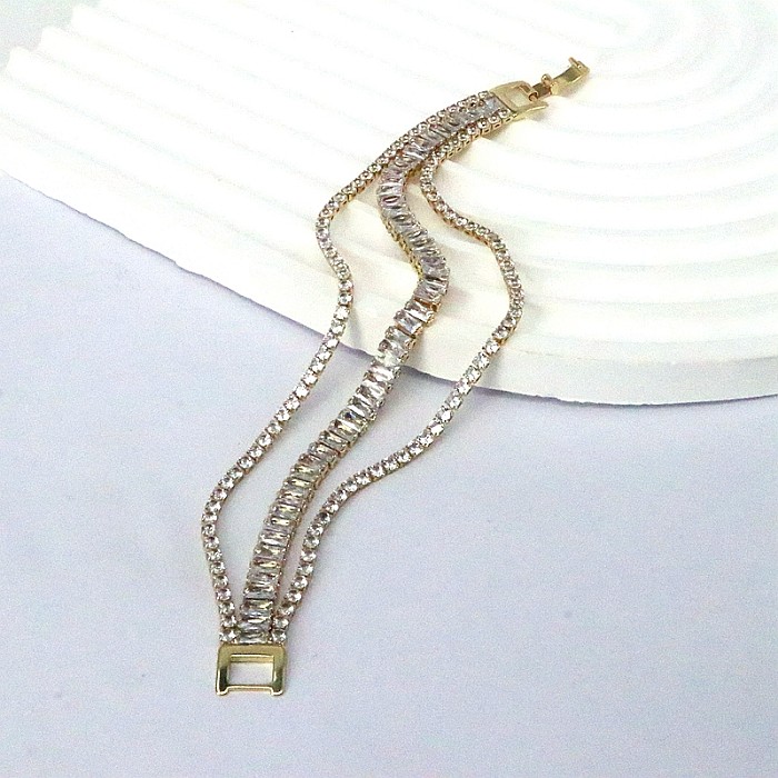 Elegantes Tennisarmband mit geometrischer Verkupferung und Inlay-Zirkon-Vergoldung