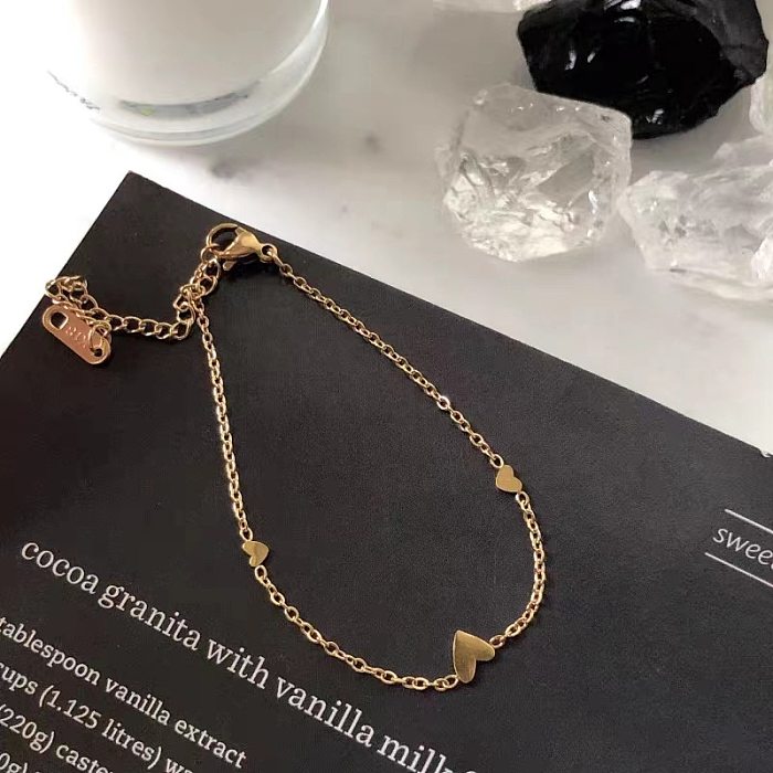 Collier de bracelets plaqués or en acier titane en forme de coeur doux