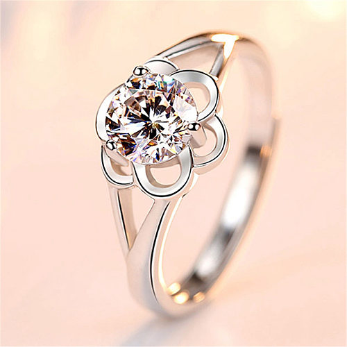 As pedras preciosas artificiais do embutimento do chapeamento de cobre da flor do estilo simples abrem anéis