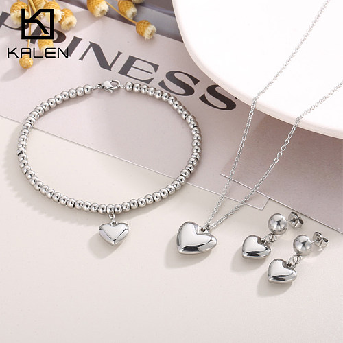 Collier de boucles d'oreilles de bracelets plaqués or 18K de placage d'acier de titane de forme de coeur de style moderne