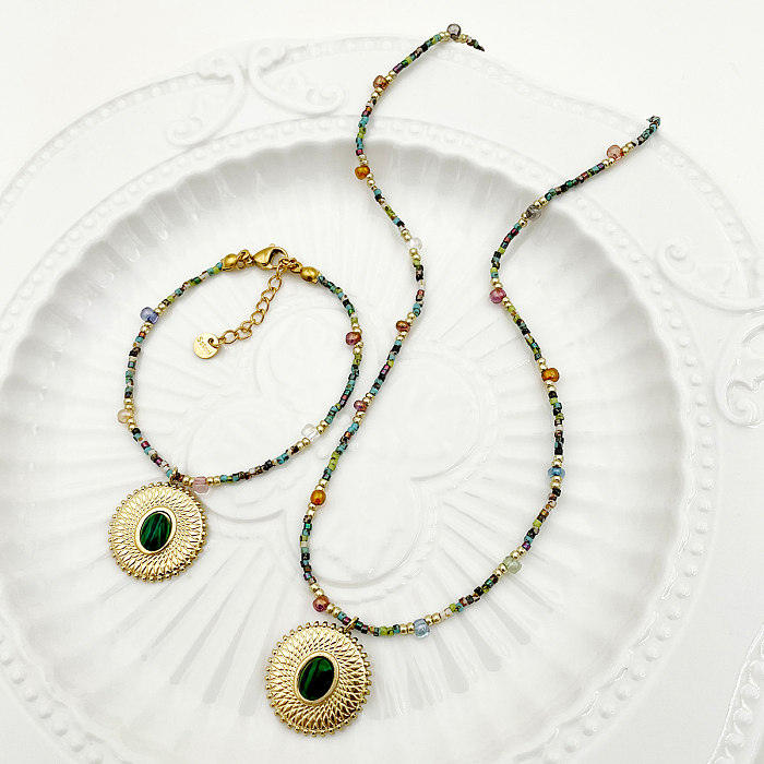 Schlichter Stil, runde Halskette mit vergoldeten Armbändern aus Edelstahl mit Perlenbeschichtung