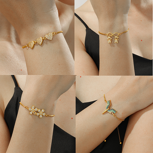 Elegante, schlichte menschliche herzförmige Blumen-Kupferbeschichtung mit Zirkon-Inlay, 18 Karat vergoldete Armbänder