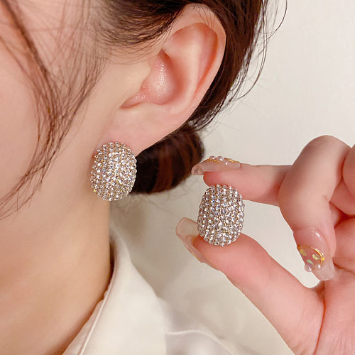 Pendientes tipo botón con diamantes de imitación, chapado en cobre, ovalados, estilo simple, 1 par