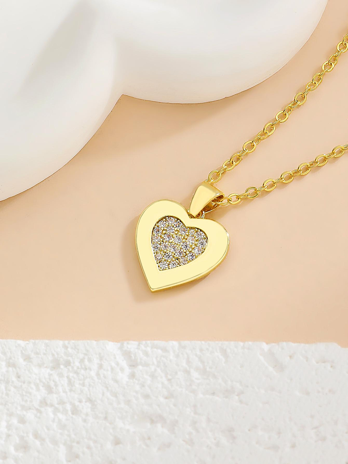 Collar de pendientes chapado en oro de 14 quilates con revestimiento de cobre en forma de corazón de estilo simple