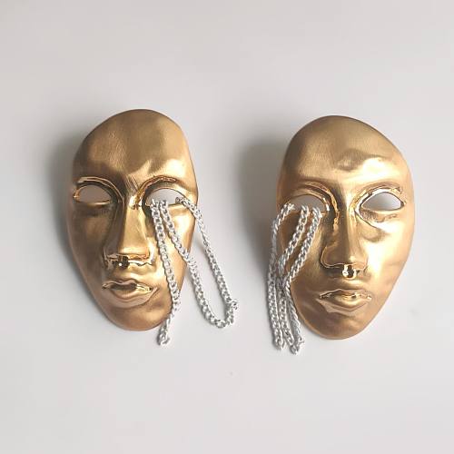 1 paire de clous d'oreilles en cuivre plaqué visage humain de style vintage