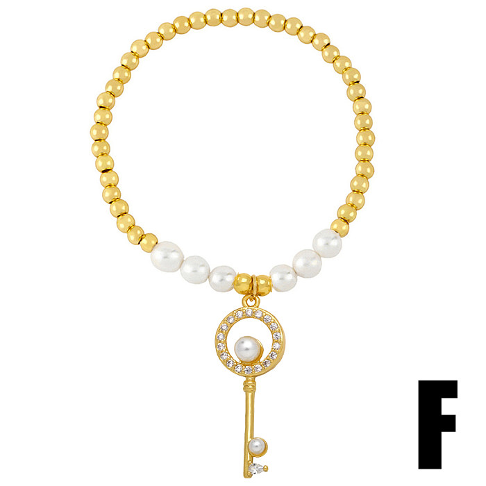 Estilo barroco formato de coração arco nó chave cobre banhado a ouro pérolas artificiais pulseiras de zircônia 1 peça