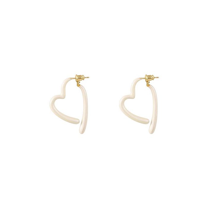 1 paire de boucles d'oreilles rondes en forme de cœur, Style Simple et décontracté, incrustation de cuivre et de Zircon