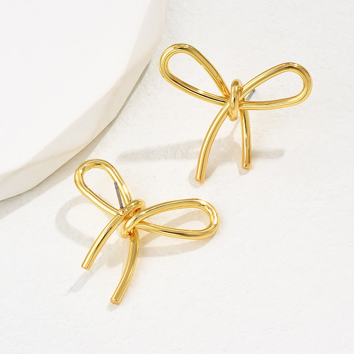 1 paire de clous d'oreilles en cuivre avec nœud papillon de Style français pour femme élégante