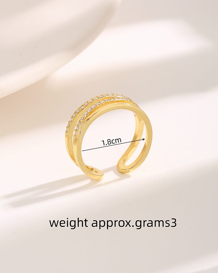 O estilo simples comuta anéis abertos banhados a ouro do zircão 18K do embutimento do chapeamento de cobre da forma de C