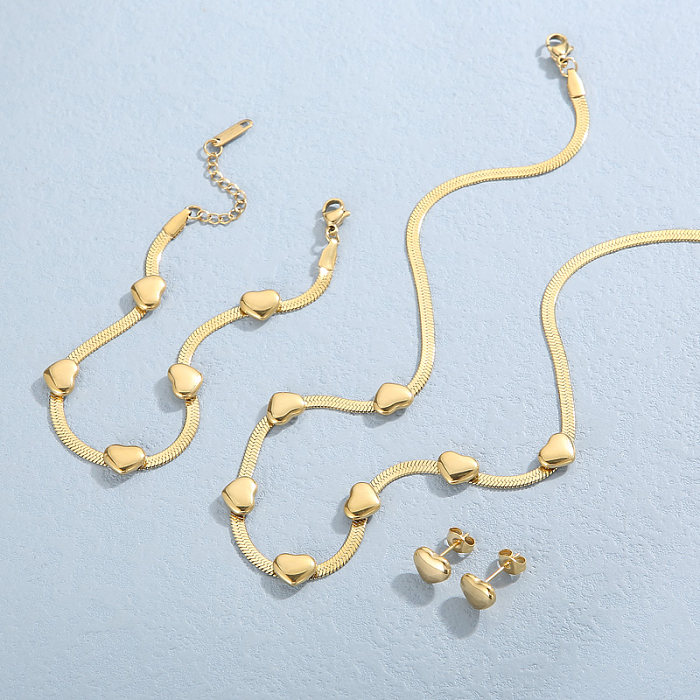 Collier de boucles d'oreilles de bracelets plaqués or 18 carats de placage d'acier de titane géométrique de vacances décontractées
