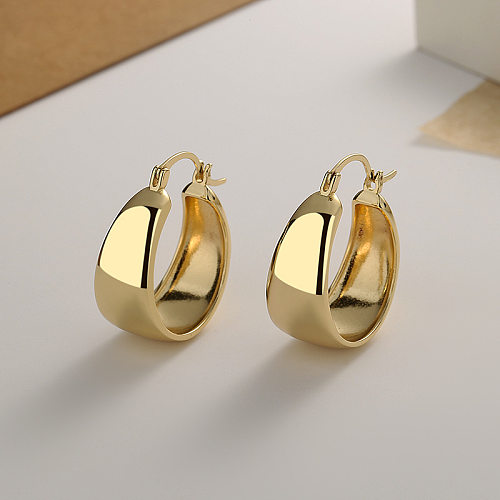 1 paire de boucles d'oreilles élégantes en forme de U plaquées cuivre et or