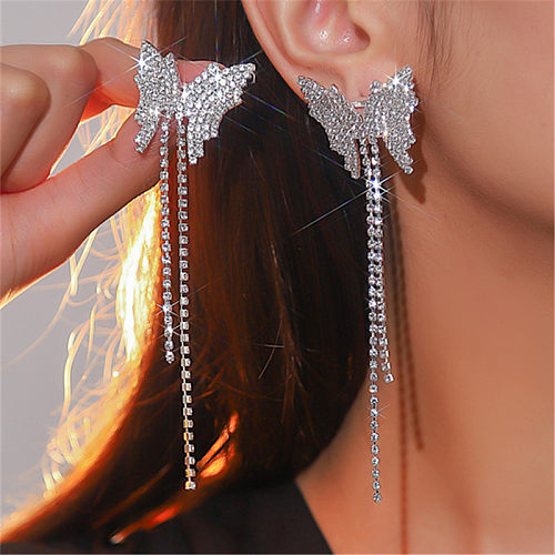 1 paire de boucles d'oreilles pendantes avec incrustation de papillon brillant, strass en cuivre plaqué argent