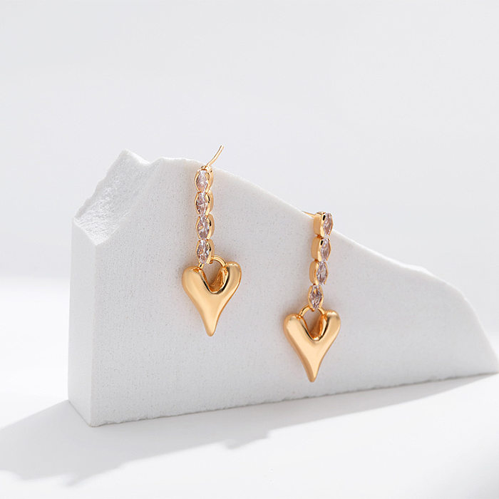 1 par de pendientes colgantes de circonita de cobre con incrustaciones en forma de corazón de estilo simple