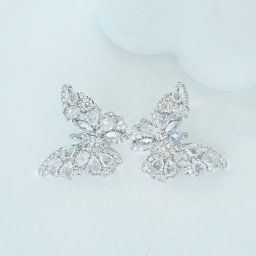 1 paire de clous d'oreilles en cuivre et Zircon avec incrustation de papillon doux