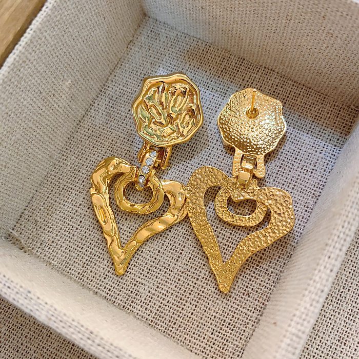 1 paire de boucles d'oreilles pendantes en cuivre plaqué en forme de cœur