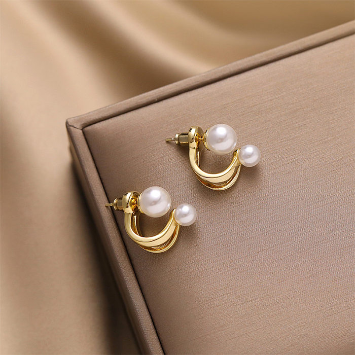 1 paire de clous d'oreilles en perles artificielles, nœud papillon géométrique pour femme, incrustation en cuivre