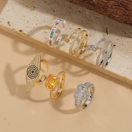 Elegante, luxuriöse, klassische, geometrische Teufelsauge-Verkupferungs-Inlay-Zirkon-offene Ringe mit 14-Karat-Vergoldung
