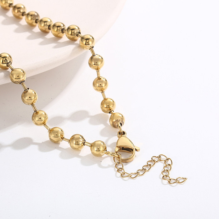 Elegante collar de pendientes chapado en oro de 18 quilates con revestimiento de pulido de acero de titanio de color sólido para mujer