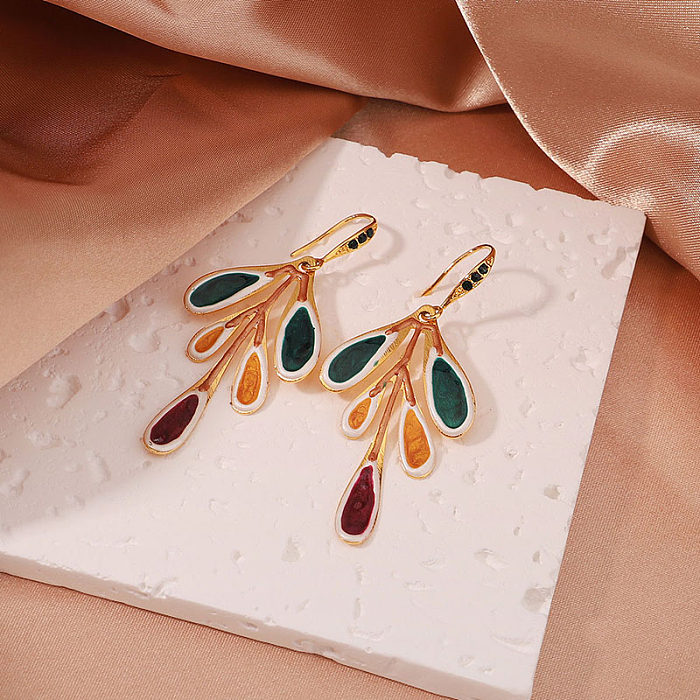 1 paire de boucles d'oreilles pendantes en cuivre plaqué or 18 carats, style streetwear artistique élégant, feuilles irrégulières peintes