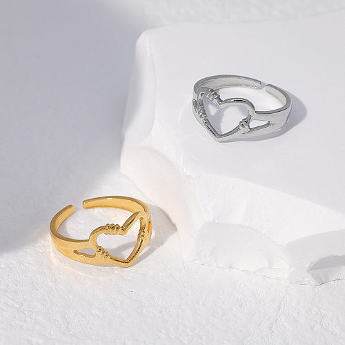O chapeamento de aço inoxidável da forma simples romântica do coração do estilo oca o anel aberto