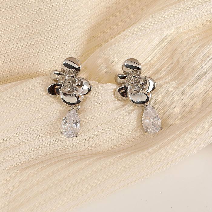 1 paire de boucles d'oreilles pendantes plaquées or 18 carats avec incrustation de placage géométrique de style moderne en cuivre et zircon