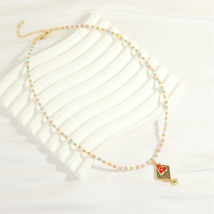 Halskette mit Anhänger im IG-Stil, Buchstaben-Herzform, Glas, Kupferperlen, Emaille-Beschichtung, 18 Karat vergoldet
