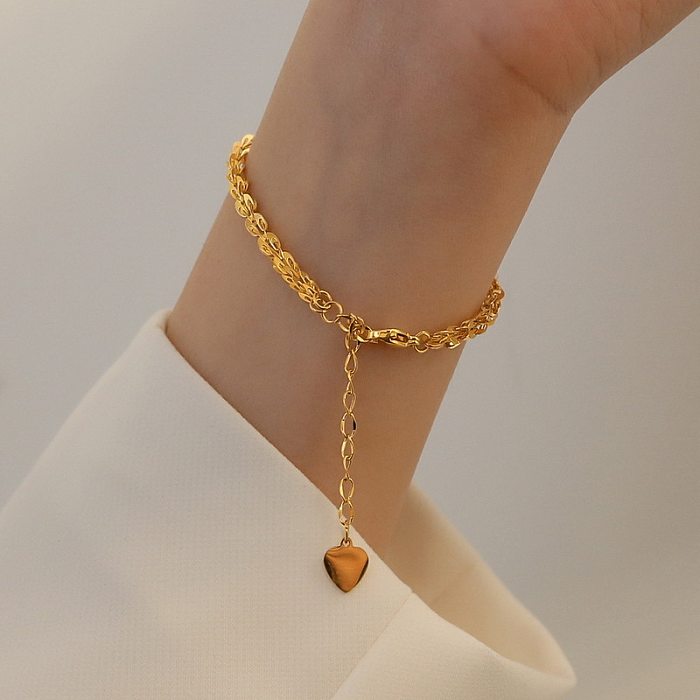 Collier de bracelets en or incrusté d'acier de titane de couleur unie en forme de coeur de mode