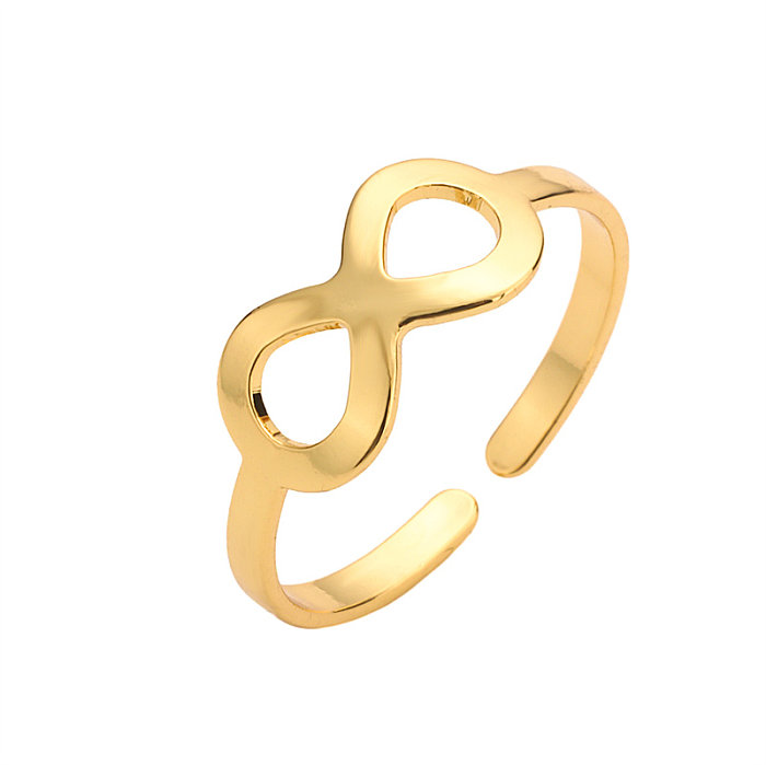 Elegante Retro-Streetwear-geometrische Bogenknoten-Kupferbeschichtungs-Inlay-Zirkon-vergoldete offene Ringe