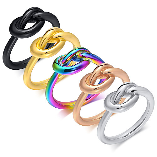 Anéis de aço inoxidável em bloco colorido de estilo simples