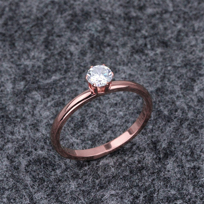 Venta al por mayor de anillos de circón chapados en oro rosa con incrustaciones de revestimiento de acero de titanio de acero inoxidable de color sólido informal al por mayor