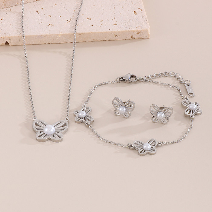 Einfaches Herzform-Schmetterlings-Titanstahlüberzug-Inlay-künstliche Perlen 18K vergoldete Ohrringe-Halsketten-Schmuckset