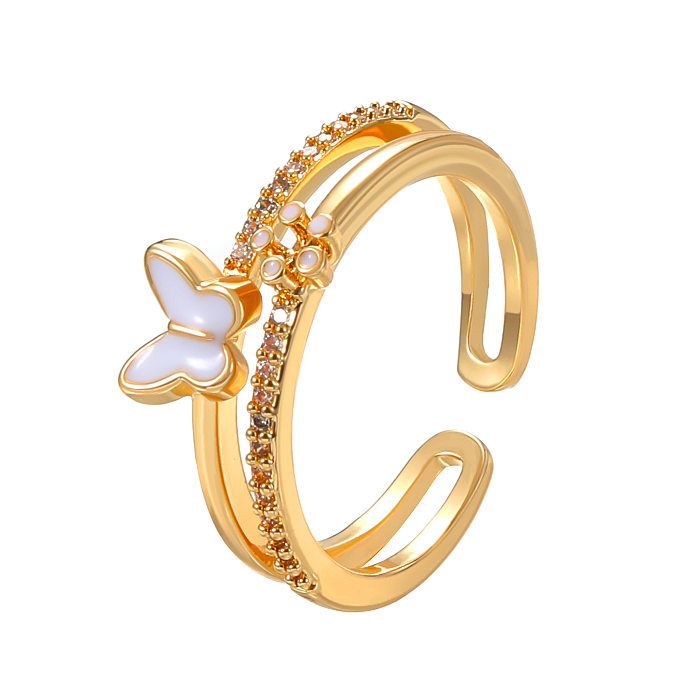 Offene Ringe im IG-Stil, grundlegender geometrischer Schmetterling, Kupferbeschichtung, Inlay aus Zirkon, 14 Karat vergoldet
