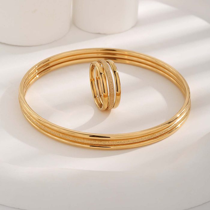 Pulseiras de anéis banhados a ouro com chapeamento de aço de titânio redondo estilo simples e luxuoso