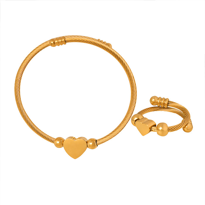 Großhandel mit eleganten herzförmigen Ringen und Armbändern aus Titanstahl mit 18 Karat Gold