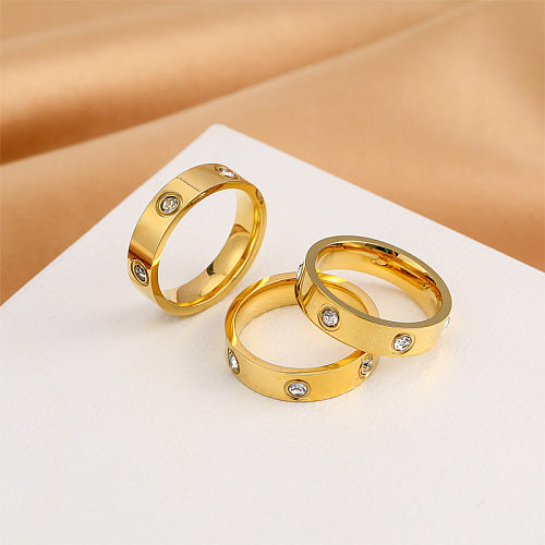 Runde Ringe im modernen Stil mit Titanstahlbeschichtung und Inlay aus künstlichen Diamanten