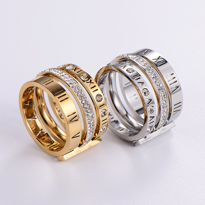 Moderner Stil, römischer Stil, römische Ziffer, Edelstahl, ausgehöhltes Inlay, künstliche Edelsteine, 18 Karat vergoldet, rosévergoldete Ringe