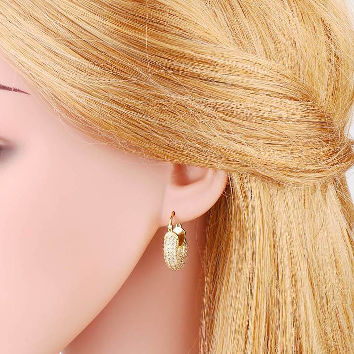 Boucles d'oreilles en cuivre géométriques à la mode Boucles d'oreilles en cuivre zircon