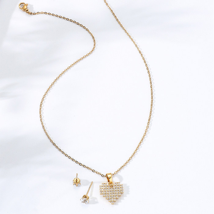 Conjunto de pendientes y collar con forma de corazón de oro de 18 quilates con incrustaciones de circonio de acero inoxidable a la moda