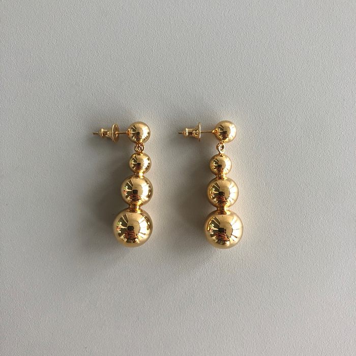 1 par de brincos redondos banhados a ouro 18K com revestimento de cobre estilo simples