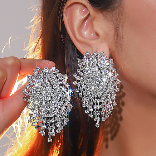 1 paire de boucles d'oreilles Glam avec incrustation de cuivre et strass plaqué argent