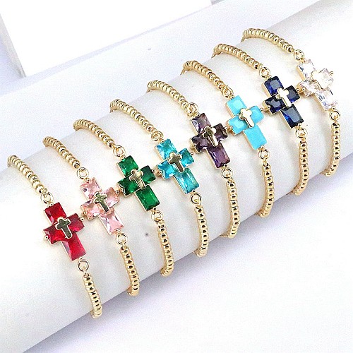 Elegante, schlichte Kreuz-Kupfer-Perlenüberzug-Inlay-Zirkon-vergoldete Armbänder