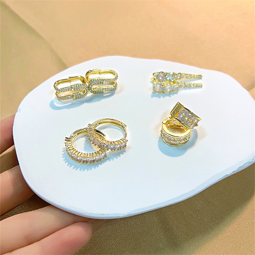 1 Paar lässige, süße, glänzende, runde, vergoldete Ohrringe mit Inlay aus Kupfer und Zirkon