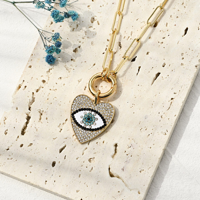 Neue kreative Clip Teufelsauge Kupfer Zirkon Halskette Damenmode Diamant-eingebetteter Herz-Auge-Anhänger